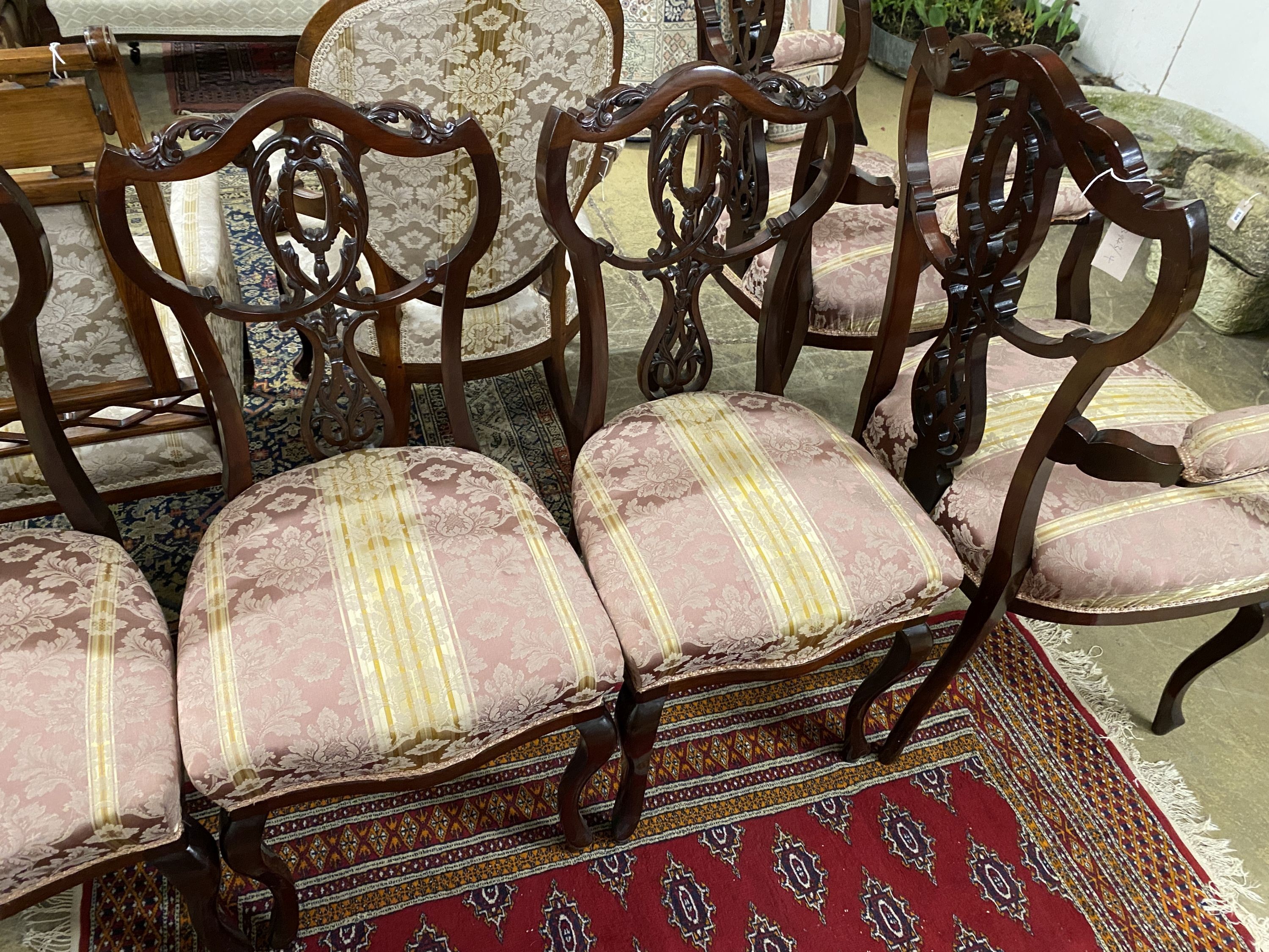 A late Victorian mahogany seven piece salon suite, settee length 120cm, depth 54cm, height 108cm